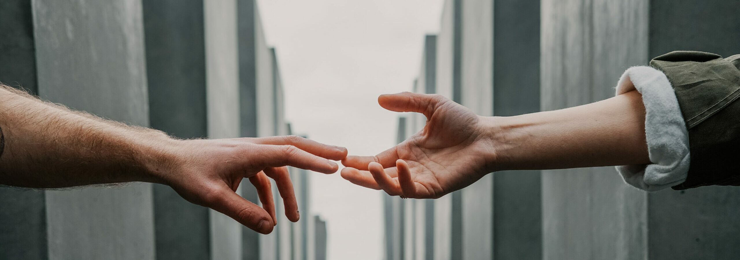 One hand approaching another hand to give shake hand